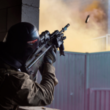 An Australian Army rifleman from Alpha Company of 8th/9th Battalion, The Royal Australian Regiment, fires an F88 Austeyr rifle into an "enemy" window during Exercise Ram Horn at Wide Bay Training Area, Queensland.
