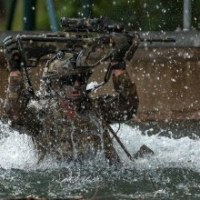 An Australian Army rifleman from the 6th Battalion, The Royal Australian Regiment jumps in the a ‘bear pit’ during the obstacle course as part of the final battle run on Exercise Viper Strike at Gallipoli Barracks, Queensland.