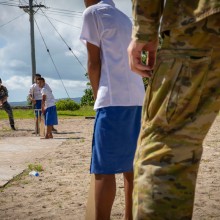 Australian Defence Force personnel play cricket with students from the Faleu primary school, Samoa, during Operation Solania 23-2.