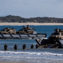 Australian Army soldiers and Bushmaster Protected Mobility Vehicles are loaded onto LHD Landing Crafts during the reconstitution of the Australian Amphibious Force during Exercise Sea Raider 2023.
