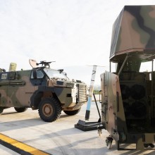 An Australian Army Bushmaster protected mobility vehicle from 5th Brigade and a CEATAC System at the release of the Defence Industry Development Strategy at CEA Technologies in Canberra.