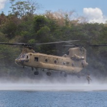 Personnel from the Australian Army, United States Army and Armed Forces of the Philippines swim to shore after helocasting from a United States Army CH-47 Chinook at Fort Magsaysay during Exercise Balikatan, Philippines.