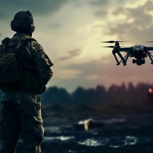 Military soldier controls drone for reconnaissance operation of enemy positions. Concept using quadcopters in smart war. Source: Adobe Stock Images