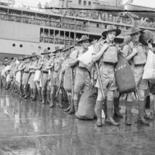 Australian soldiers disembarking a naval ship