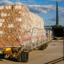 Personal Protective Equipment, destined for Indonesia, prior to being loaded on to a No. 37 Squadron C-130J Hercules at RAAF Base Amberley.