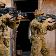 An Australian Army soldier and Army Reserve soldier conduct urban close combat clearances, during an integration activity at Townsville Field Training Area in Queensland, during Exercise Talisman Sabre 2021.