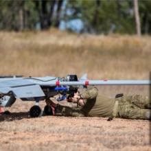 Australian Army crew chief Lieutenant Dallin Stirling attaches post-flight safety tags to a Shadow 200 during Exercise Dragon Sprint at Townsville Field Training Area, QLD.