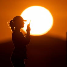 Able Seaman Aviation Support Indiana Van Arkel communicates with the bridge from the Flight Deck of HMAS Canberra during Exercise Talisman Sabre 21.