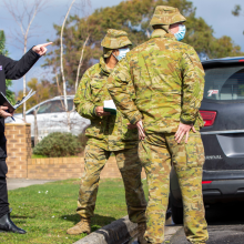 Department of Health and Human Services officer, Georges Haddad (left) and Australian Army soldiers from the 2nd/14th Light Horse Regiment, Trooper Keegan Veivers (centre) and Trooper Rylan Green (right) conduct door knocking in Colac, Victoria during Operation COVID-19 Assist.