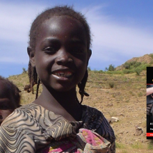 Children from Sudan in an arid environment with the cover of the Irregular Warfare Essay Collection at bottom right