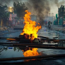 Burning debris in the middle of a street; Image by Fajrul Falah from Pixabay