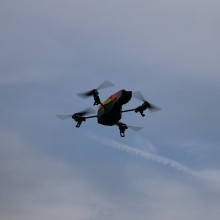 Single quad rotor drone in centre of image with sky background. Image by andri333 from Pixabay.